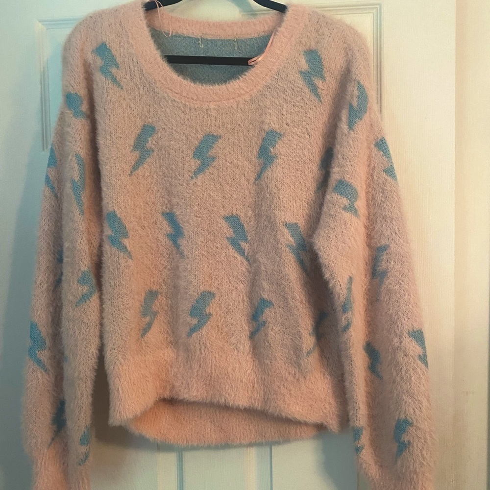 Pink and blue lightning bolt sweater